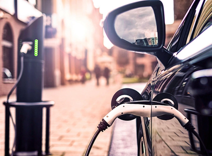 Electric vehicle connected to a public charging point